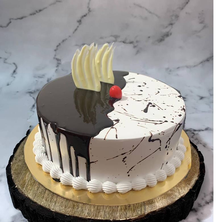 Half chocolate, half vanilla drip cake